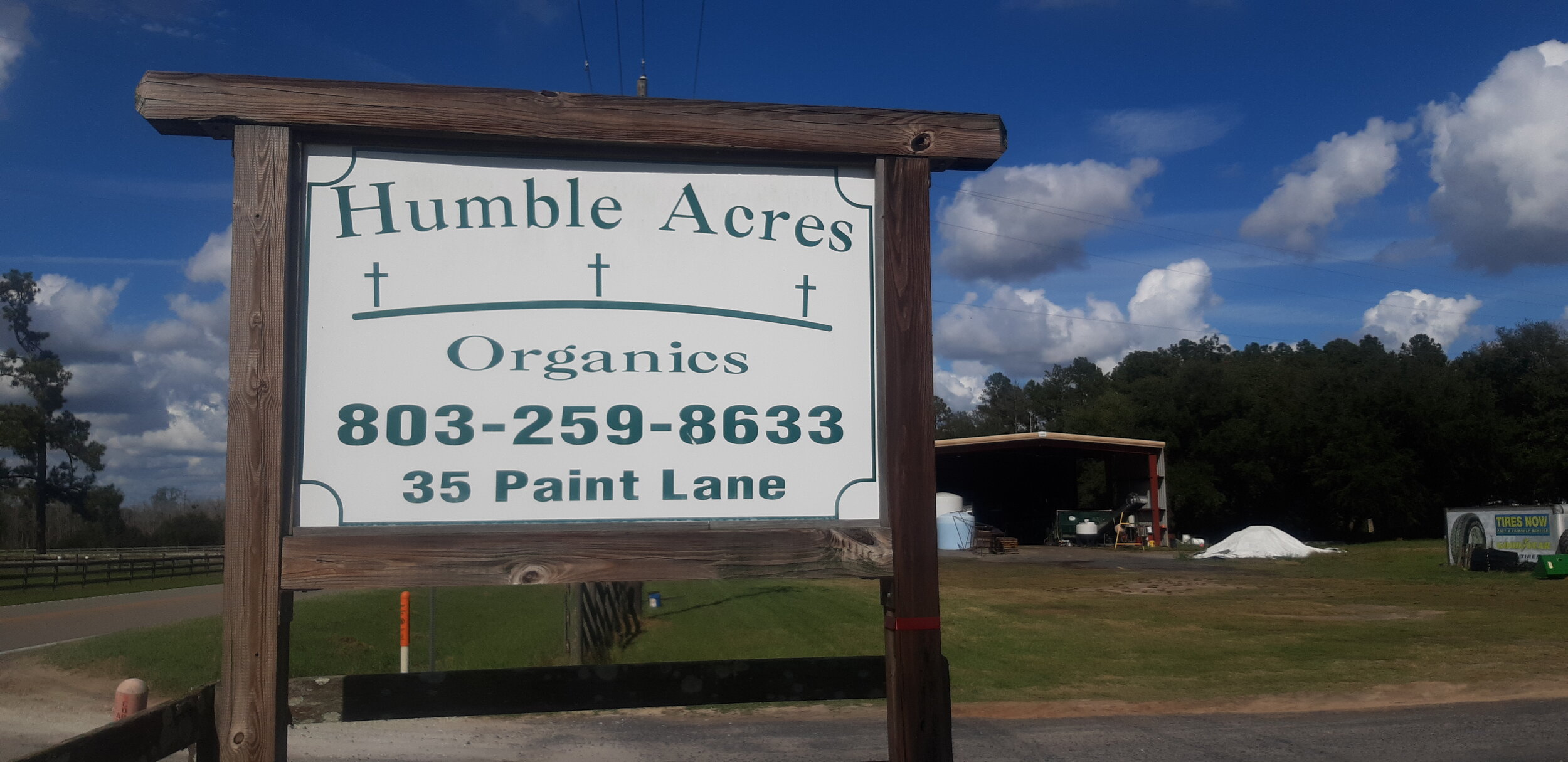 Humble Acres Organics sign showing the phone number and Paint Lane address